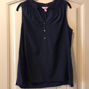 Sleeveless silk shirt with gold buttons